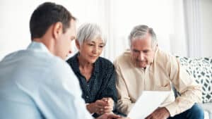 older couple looking at financial options with advisor